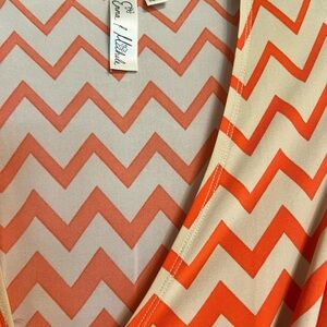 Sleeveless Chevron V-Neck Dress by Love J Neishelle in Coral & Cream
